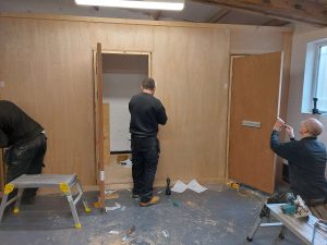 Fire Doors Complete practical fire door installation training assessment session in progress